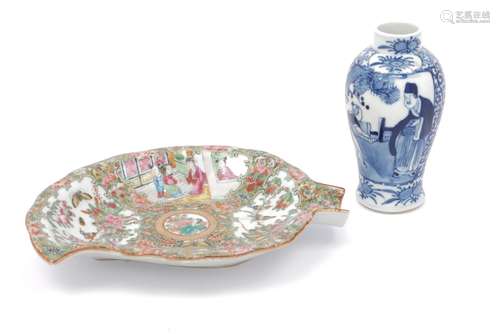 A Chinese Cantonese porcelain leaf shaped dish, late 19th century, decorated with four panels of