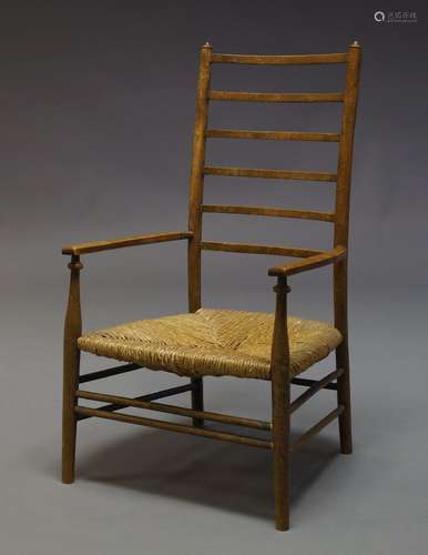 Liberty & Co, An Arts and Crafts beech ladderback side chair, with rush seat on tapered legs