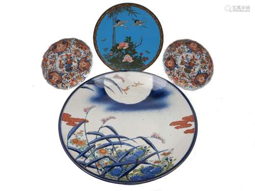 A Chinese enamel plate, late 19th/early 20th century, decorated with crane, bamboo and peony, with