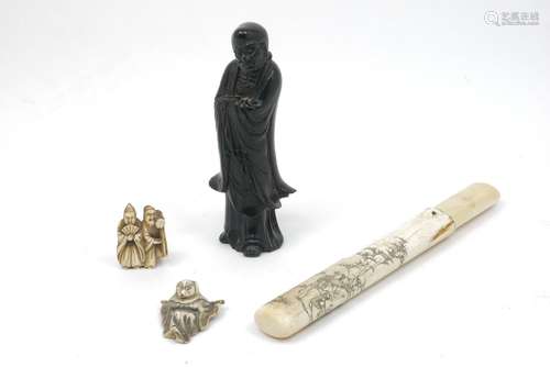 A Japanese ivory pipe case, late 19th/early 20th century, incised with decoration of a geisha with