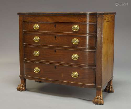 A Regency mahogany and satinwood crossbanded chest, the shaped top with moulded ebony band to