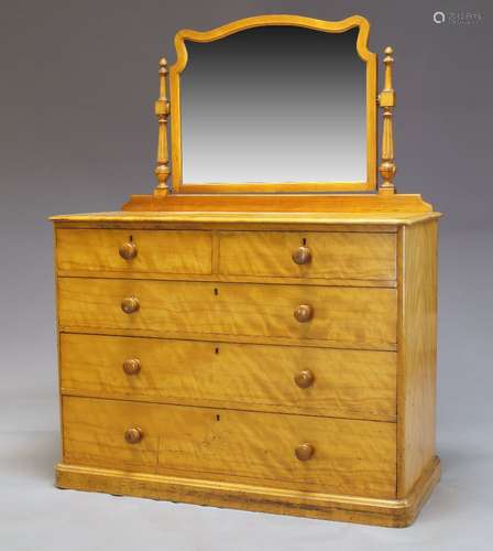 A Victorian satinwood dressing chest by Heal & Son, the top surmount with later mirror, on turned