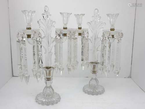 A pair of cut glass two light candelabra with cut glass droppers, 48cm high (2)Please refer to