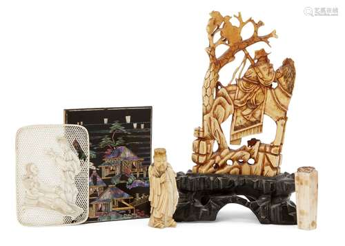 A Chinese ivory carving, 19th century, decorated with an official on horseback with an attendant,