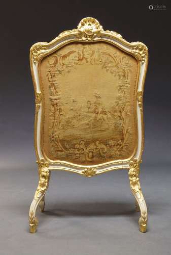 A Louis XV style white painted and parcel gilt fire screen, 20th Century, of cartouche shape, with