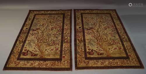 A Persian style pictorial rug, the ivory field with flowering tree, exotic birds, snake and other