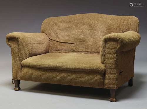 An Edwardian drop end sofa, with serpentine shaped back, upholstered in beige fabric, with one