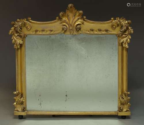 An Victorian giltwood overmantle mirror, with carved scrolling foliate decoration to frame about a