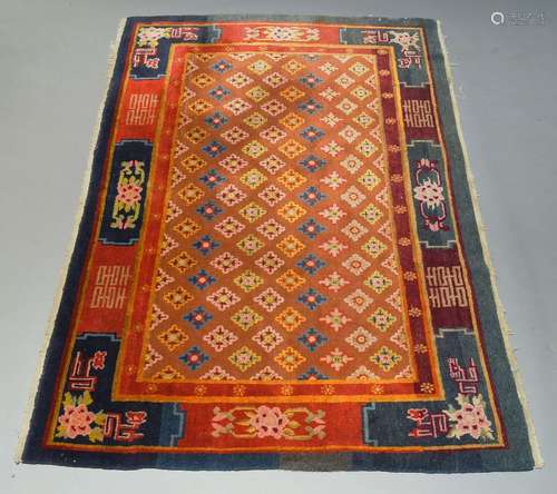 A Chinese rug, late 20th Century, with flowerheads in terracotta pattern trellis field, 236cm x