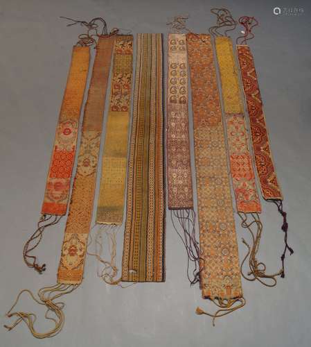 A large collection of Middle Eastern style woven stoles, each in varying prints and colour ways,