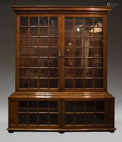 A pair of Samuel Pepys style mahogany and glazed bookcases, second half 20th Century, the moulded