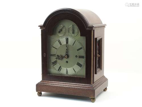 An Edwardian mahogany cased bracket clock, with dome cover, the brass dial with roman numerals,