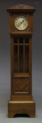 An oak grandfather clock, early 20th Century, with arched hood, the circular glazed door flanked