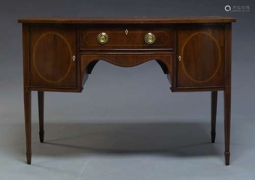 An Edwardian mahogany and line inlaid bow fronted sideboard, with single drawer flanked by two