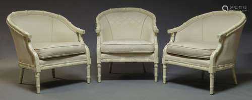 A set of three white painted and upholstered bergere armchairs, late 20th Century, with simulated