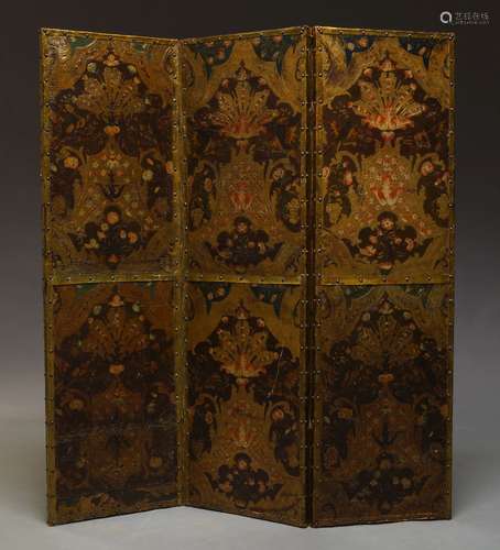 A French embossed leather three fold screen, decorated with birds and foliate sprays, with gilt