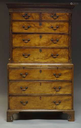 A George III mahogany chest on chest, with dentil moulded cornice above blind-fret carved frieze and