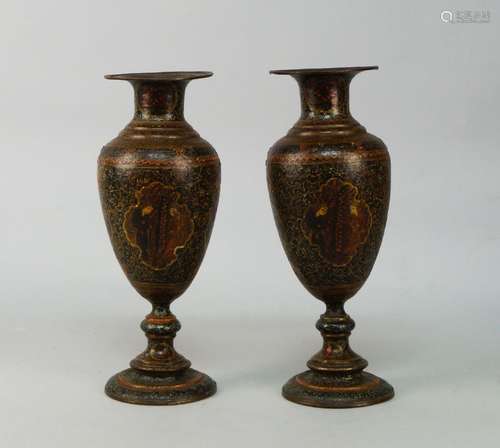 A pair of Persian lacquered metal vases, late 19th/early 20th century, with shaped panels to front