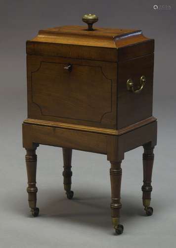 A Regency mahogany and ebony strung wine cooler, of sarcophagus form, the lid surmount with brass