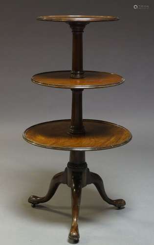 A George III mahogany three-tier dumb waiter, with turned tapering supports to tripod base, 100cm