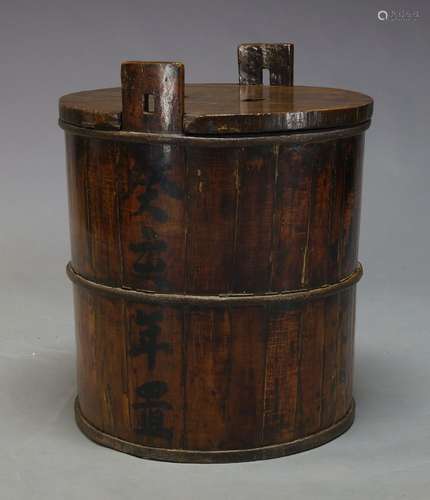 A large Japanese cast iron bound sake barrel, late 19th Century, of cylindrical form, the sides