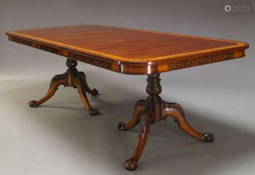 A Georgian taste mahogany extending dining table, late 20th Century, the rounded rectangular top