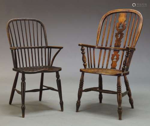 A Victorian elm and beech Windsor armchair, with hooped spindle back, above saddle seat on turned