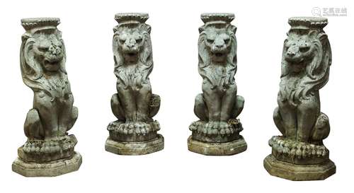 A set of four re-constituted stone seated lions, 20th century, together with a pair of re-