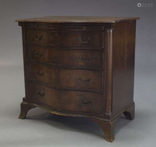 A George III style mahogany serpentine chest of drawers, early to mid 20th Century, with brushing