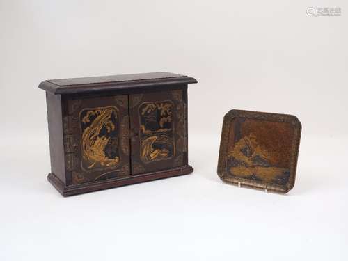 A small 20th century Chinese two door jewellery cabinet with a single interior compartment, the