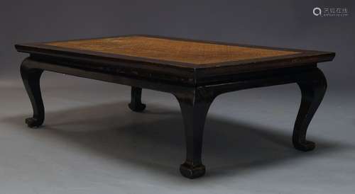 A Chinese low table, late 19th, early 20th Century, the rectangular top inset with rattan panel,