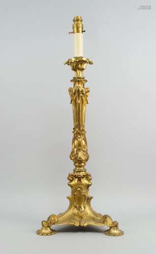 A gilt bronze oil lamp base , 19th century, moulded with scrolling foliage, on a triangular base,