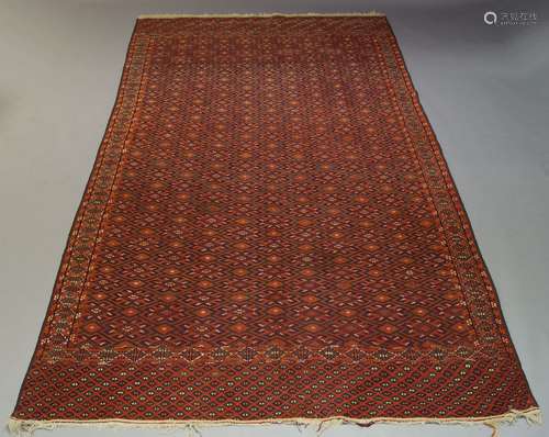 An Anatolian Kilim, with repeat geometric motif in red field, 318cm x 196cm, together with another