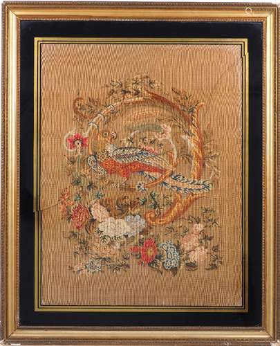 A Victorian woolwork tapestry depicting a pheasant within a vine and acanthus and additional