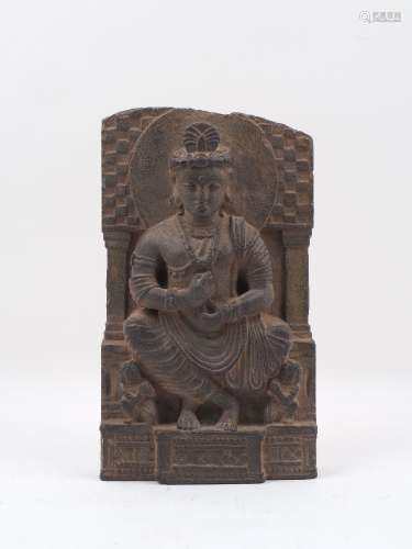A carved Gandara stone figural plaque, in 2nd/3rd century AD style, depicting seated Budda,