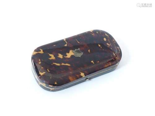 A Victorian tortoise shell necessaire, of canted rectangular form, the hinged cover with white metal