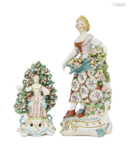 An English porcelain figure of a lady, probably Derby, 18th century, modelled wearing a floral dress