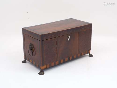 A George III mahogany inlaid cross banded three-section tea caddy, with glass liner and removable