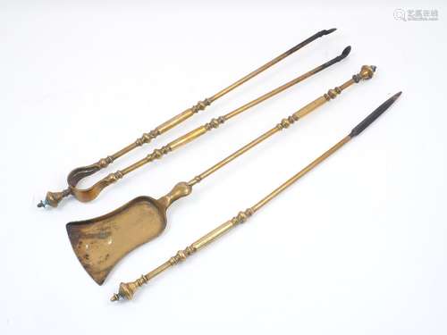 A Georgian set of three brass fire irons, to include a poker, a pair of tongs and a shovel, each