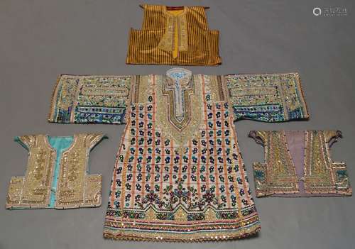 A Turkish waistcoat, 20th century, with red and yellow striped material, enriched with silver