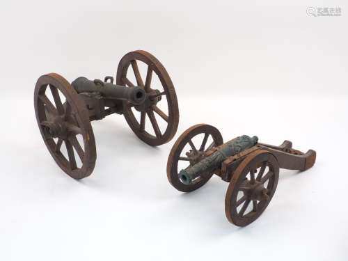 An early 20th century field cannon model, the tapered barrel pivoting on a pierced curved frame,