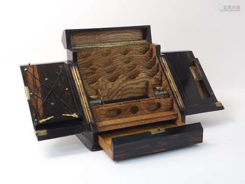 A Victorian coromandel stationary box, of typical form, the hinged sloped doors encasing letter