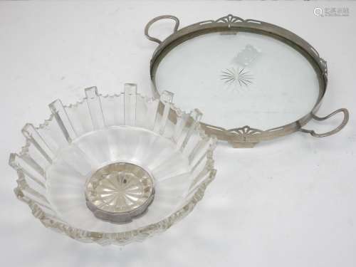 A pewter mounted glass tray, of circular form, with two handles and a raised rim with pierced