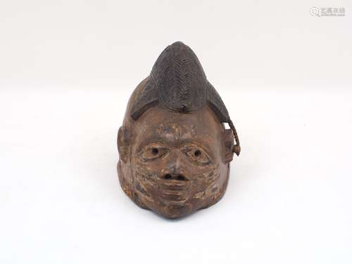 A Yoruba style dance mask, 20th century, with headdress detail, 30cm long (AF)Please refer to