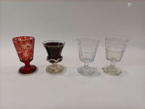 BOHEME A suite of four pedestal cups, one in red a…
