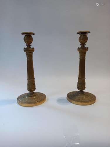 Pair of gilt bronze torches with relief decoration…