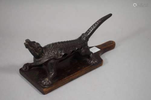 Cast iron pharmacist's cork with a crocodile. Numb…