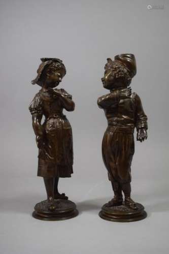 Couple of bronze children forming a pendant. Cast …