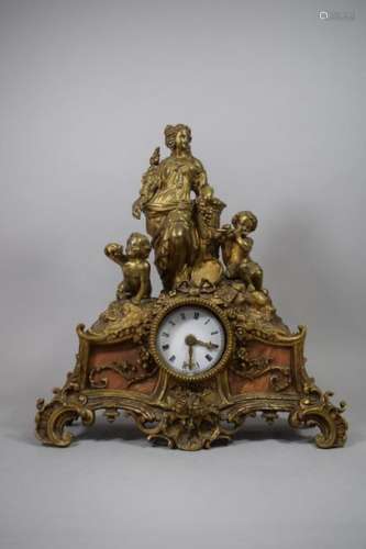 Gilt bronze clock depicting an allegory of the vin…