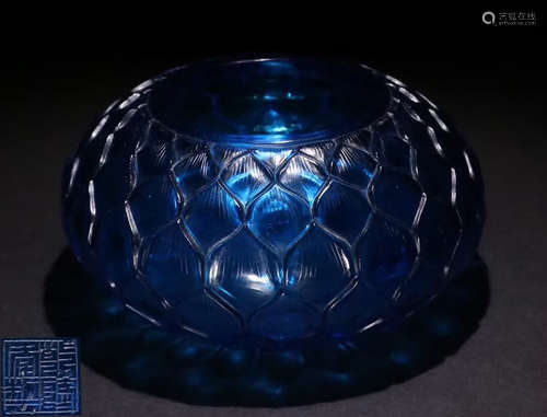 A BLUE GLASS BRUSH WASHER SHAPED WITH FLOWER